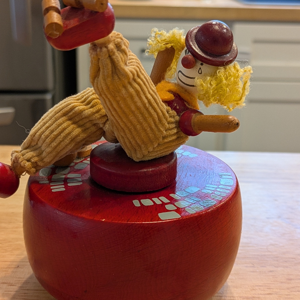 Wooden Clown Figurine with Red Base